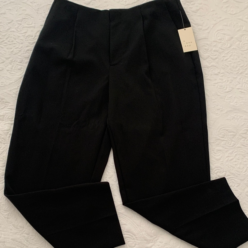 a. new day black trousers pleaded  tapered leg slim hip and thigh stretch